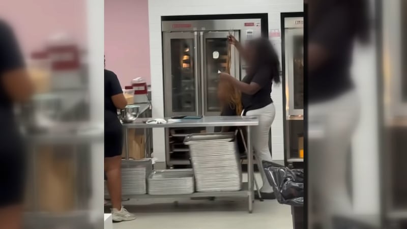 A video circulating on social media shows Crumbl Cookies employees apparently doing hair...