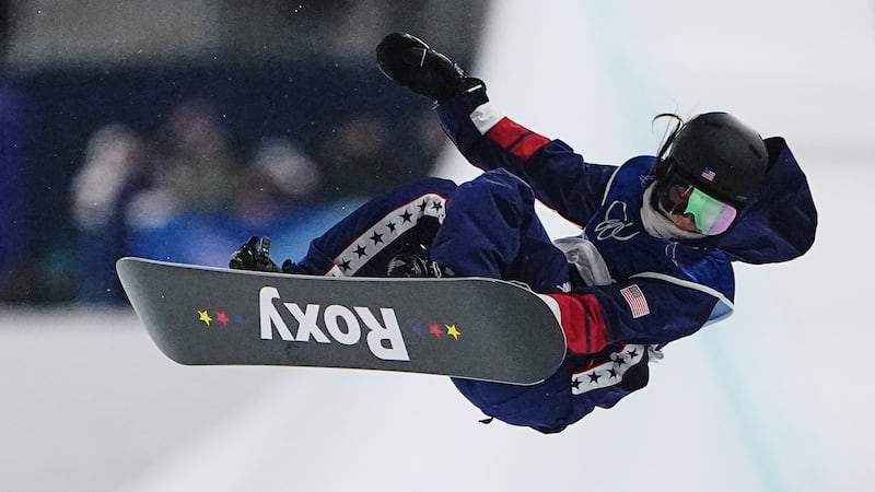 United States' Chloe Kim falls during the women's snowboarding halfpipe finals at the 2026...